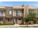 Modern townhome with stone exterior and landscaped walkway at 3224 Brasilia Ave # 3224, Kissimmee, FL 34747