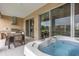 Outdoor kitchen, hot tub, and patio furniture at 3224 Brasilia Ave # 3224, Kissimmee, FL 34747