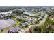 This aerial perspective shows a community near a serene pond, highlighting a peaceful and attractive residential setting at 337 Fern Lake Dr, Orlando, FL 32825