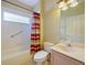 Bathroom features a shower/tub combo and vanity at 337 Fern Lake Dr, Orlando, FL 32825