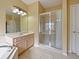 Bathroom with vanity, shower, and tiled floors at 337 Fern Lake Dr, Orlando, FL 32825