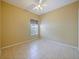 The bedroom has tile flooring, ceiling fan and a window at 337 Fern Lake Dr, Orlando, FL 32825