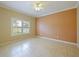 Bright bedroom with tile flooring, a ceiling fan, and large windows offering natural light at 337 Fern Lake Dr, Orlando, FL 32825