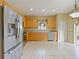 Kitchen with stainless steel appliances and light wood cabinets at 337 Fern Lake Dr, Orlando, FL 32825