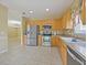 Kitchen with stainless steel appliances and wood cabinets at 337 Fern Lake Dr, Orlando, FL 32825