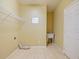 Laundry room features tile floors, a utility sink, and shelving at 337 Fern Lake Dr, Orlando, FL 32825