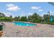 Community pool with lounge chairs and brick patio at 337 Fern Lake Dr, Orlando, FL 32825