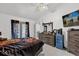 Bedroom with king bed, dresser, and sliding glass doors at 3717 Jericho Dr, Casselberry, FL 32707