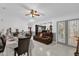 Open concept dining room and living area with dark brown furniture at 3717 Jericho Dr, Casselberry, FL 32707