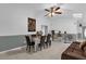 Elegant dining area with a large tiger painting and ceiling fan at 3717 Jericho Dr, Casselberry, FL 32707