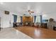 Spacious living room featuring wood-look floors and a ceiling fan at 3717 Jericho Dr, Casselberry, FL 32707