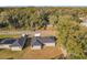 Two new construction homes, one with solar panels, seen from above at 413 Ruby Ave, Deland, FL 32724