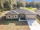 Newly built home with gray exterior and a two-car garage at 413 Ruby Ave, Deland, FL 32724