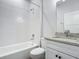 Clean bathroom with white subway tile and granite vanity at 413 Ruby Ave, Deland, FL 32724