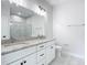 Modern bathroom with double vanity and granite countertops at 413 Ruby Ave, Deland, FL 32724