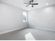 Bright bedroom with ceiling fan and grey carpet at 413 Ruby Ave, Deland, FL 32724