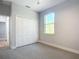 Spacious bedroom with neutral walls, carpeting, and a large closet at 413 Ruby Ave, Deland, FL 32724