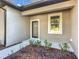 Front entry with modern door and landscaping at 413 Ruby Ave, Deland, FL 32724