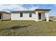 A well-maintained lawn enhances this house with a covered outdoor patio and ample green space at 4537 Sidesaddle Trl, St Cloud, FL 34772