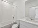 Clean, modern bathroom with white subway tile, a shower/tub combo, and a single sink vanity at 4537 Sidesaddle Trl, St Cloud, FL 34772