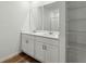 Bathroom featuring double sinks and a large mirror at 4537 Sidesaddle Trl, St Cloud, FL 34772