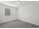 Bedroom with neutral carpeting, a window, and white walls at 4537 Sidesaddle Trl, St Cloud, FL 34772