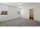 Bedroom featuring neutral carpet and two windows with a view to the outdoors at 4537 Sidesaddle Trl, St Cloud, FL 34772