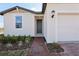 Close up of a single-story home featuring a brick walkway and freshly landscaped front yard at 4537 Sidesaddle Trl, St Cloud, FL 34772