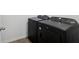 Laundry area featuring black washer and dryer at 4537 Sidesaddle Trl, St Cloud, FL 34772