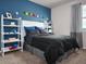 Bedroom with black bedding and themed decor at 4569 Cross Prairie Pkwy, St Cloud, FL 34772