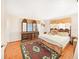 Large bedroom with a king-size bed and wood dresser at 5240 N Powers Dr, Orlando, FL 32818