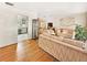 Living room with hardwood floors and neutral colored sofas at 5240 N Powers Dr, Orlando, FL 32818