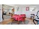 Cozy dining area with red tablecloth and views into the living room at 544 Eartha Ln, Orlando, FL 32805