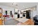 Renovated kitchen featuring white shaker cabinets and black appliances at 544 Eartha Ln, Orlando, FL 32805