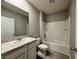 Clean bathroom with a shower/tub combo and updated vanity at 617 Finn Ave, Auburndale, FL 33823