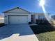 One-story home with attached garage and neat landscaping at 617 Finn Ave, Auburndale, FL 33823