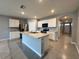 Eat-in kitchen, featuring stainless steel appliances and island at 617 Finn Ave, Auburndale, FL 33823