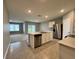 Modern kitchen with stainless steel appliances and an island at 617 Finn Ave, Auburndale, FL 33823