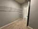 Large walk-in closet with wire shelving and carpet at 617 Finn Ave, Auburndale, FL 33823