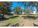 Large grassy backyard with mature trees at 622 Glastonbury Dr, Orlando, FL 32825