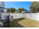 Small, fenced backyard with grass and AC unit at 622 Glastonbury Dr, Orlando, FL 32825