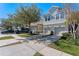 Attractive gray townhomes with two-car garages and neatly landscaped yards at 622 Glastonbury Dr, Orlando, FL 32825