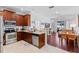 Modern kitchen with stainless steel appliances and light wood cabinets at 622 Glastonbury Dr, Orlando, FL 32825