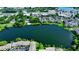 Aerial view of waterfront community with lake, lush landscaping, and residential buildings at 646 Jasmine Rd, Altamonte Springs, FL 32701