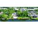 Aerial view of property, showcasing lakefront access and lush landscaping at 646 Jasmine Rd, Altamonte Springs, FL 32701