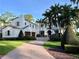 Luxury home exterior with brick driveway and palm trees at 646 Jasmine Rd, Altamonte Springs, FL 32701