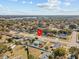 Aerial view of a single-story house and its location in a larger community at 7852 Murcott Cir, Orlando, FL 32835