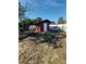 Backyard with a red storage shed at 7852 Murcott Cir, Orlando, FL 32835