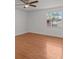 Bright bedroom with wood-look floors and ceiling fan at 7852 Murcott Cir, Orlando, FL 32835