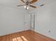 Spacious bedroom with wood-look floors and ceiling fan at 7852 Murcott Cir, Orlando, FL 32835